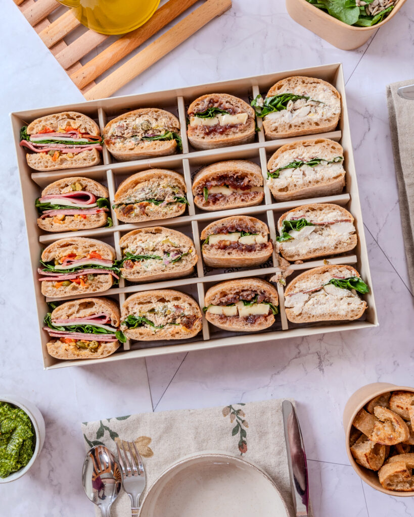 EatJoy ShareBox with 16 mini sandwich pieces for catering in Amman